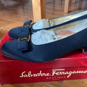 Salvatore Ferragamo black leather pumps with gold buckle and ribbon